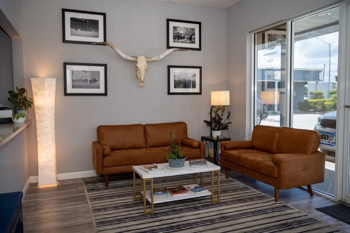 The Zen Medicine waiting room with leather sofas and warm lighting